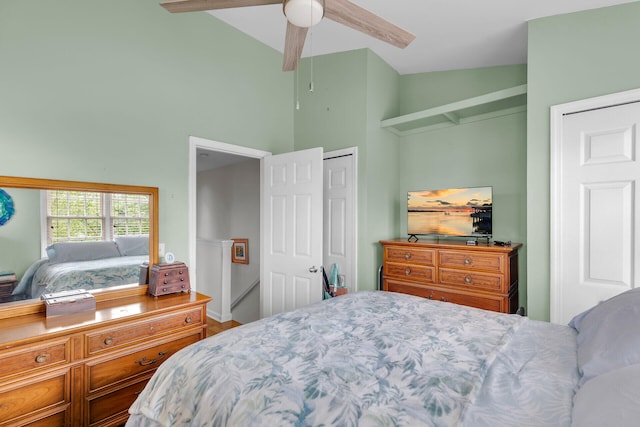 bedroom with vaulted ceiling and a ceiling fan