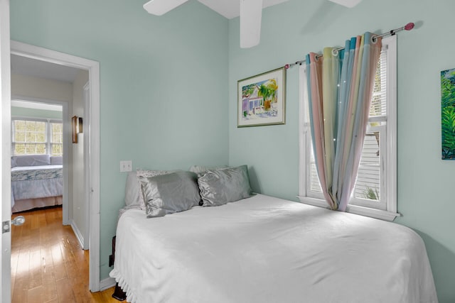 bedroom with hardwood / wood-style flooring