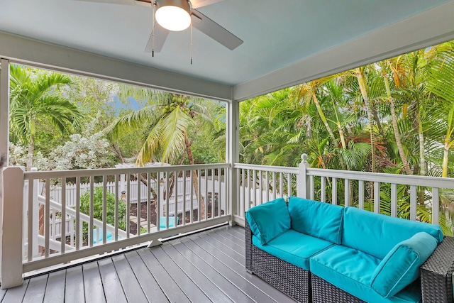 wooden terrace featuring a ceiling fan