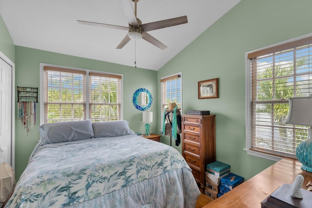 bedroom with lofted ceiling, ceiling fan, and a closet