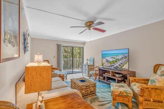 201 E Ocean Dr Unit 211, Key Colony, FL 33051 - living room featuring ceiling fan