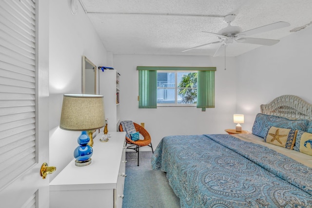 201 E Ocean Dr Unit 211, Key Colony, FL 33051 - bedroom with carpet floors, a textured ceiling, and a ceiling fan