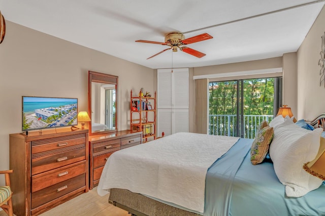 201 E Ocean Dr Unit 211, Key Colony, FL 33051 - bedroom featuring access to outside, ceiling fan, and light wood-type flooring