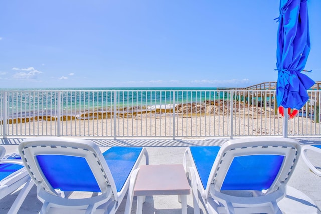 201 E Ocean Dr Unit 211, Key Colony, FL 33051 - view of patio featuring view of water and beach