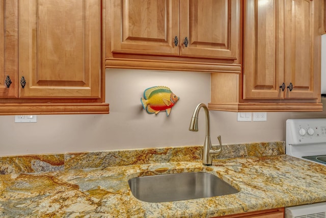 201 E Ocean Dr Unit 211, Key Colony, FL 33051 - kitchen view of a sink, light stone counters, and white electric stove