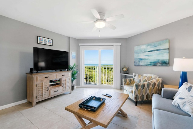 living room featuring ceiling fan and light tile patterned floors