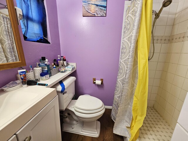 bathroom with vanity, toilet, and a shower with curtain
