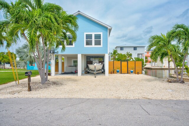 coastal inspired home featuring a carport