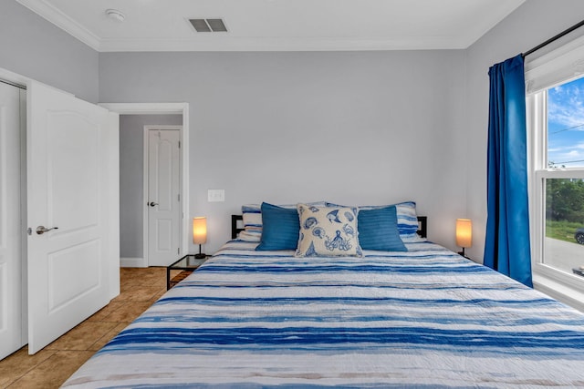 tiled bedroom with crown molding