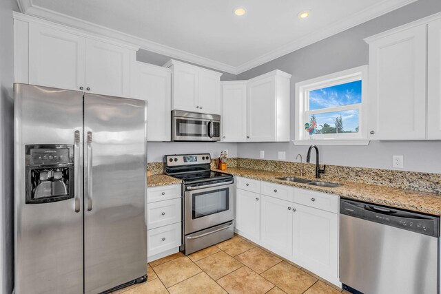 kitchen featuring white cabinetry, sink, ornamental molding, and stainless steel appliances