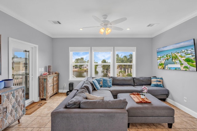 living room with ceiling fan, ornamental molding, a healthy amount of sunlight, and light tile patterned floors