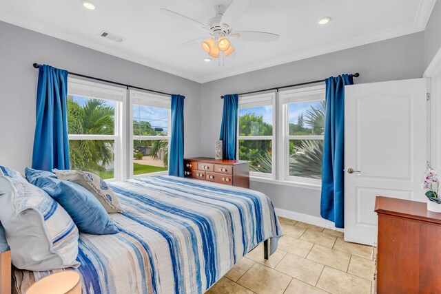 tiled bedroom featuring crown molding and ceiling fan