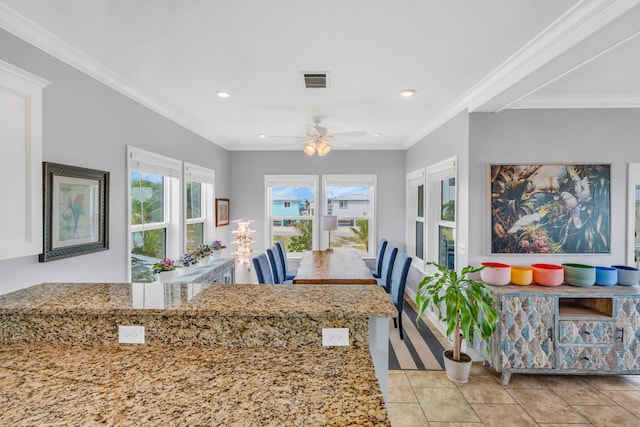 dining room featuring crown molding, ceiling fan, and light tile patterned flooring