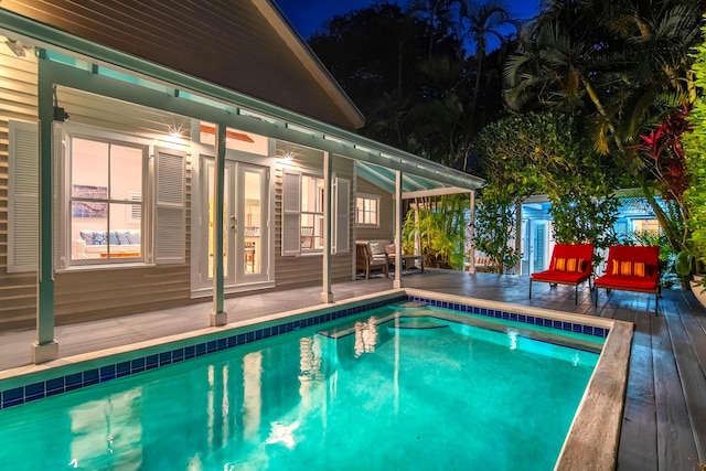 view of swimming pool featuring a deck