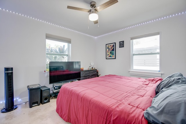 bedroom featuring light tile patterned floors and ceiling fan