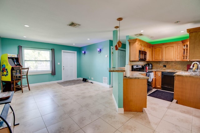 kitchen featuring hanging light fixtures, tasteful backsplash, light stone counters, black appliances, and kitchen peninsula