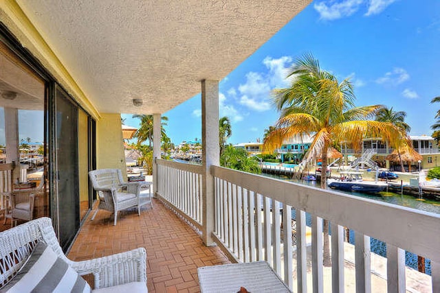 balcony featuring a water view