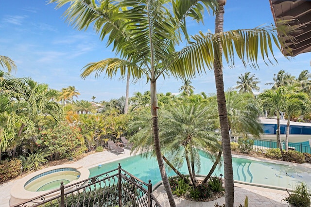 view of pool featuring a hot tub