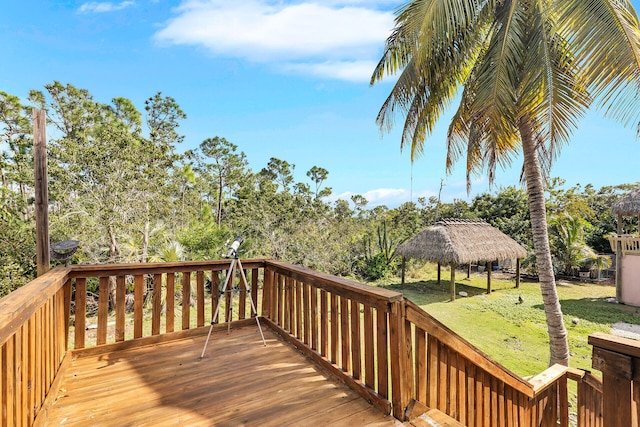 deck featuring a gazebo and a yard