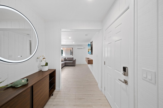 corridor with light wood-style floors