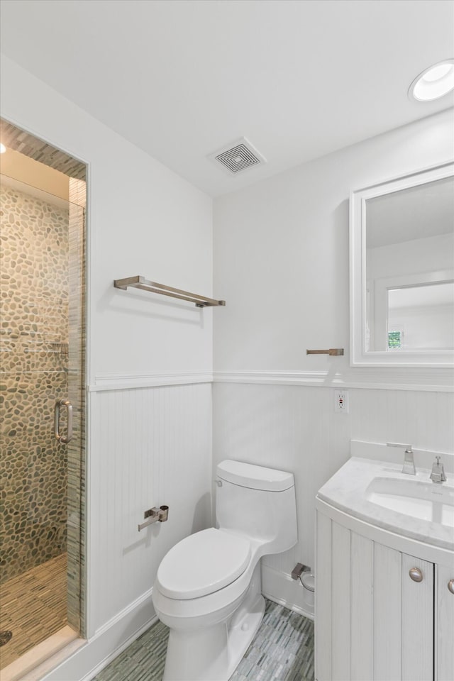 413 Emma St Unit A, Key West, FL 33040 - full bathroom featuring a wainscoted wall, a shower stall, vanity, and wood finished floors