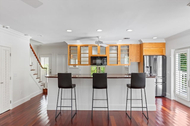 413 Emma St Unit A, Key West, FL 33040 - kitchen featuring black microwave, stainless steel fridge with ice dispenser, a ceiling fan, dark wood finished floors, and a breakfast bar