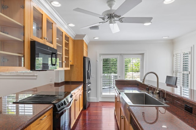 413 Emma St Unit A, Key West, FL 33040 - kitchen featuring black appliances, ornamental molding, dark wood finished floors, ceiling fan, and dark stone countertops