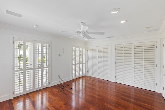 413 Emma St Unit A, Key West, FL 33040 - unfurnished bedroom featuring access to exterior, ornamental molding, two closets, wood finished floors, and recessed lighting
