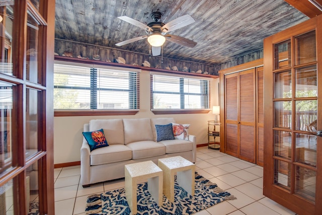 tiled living room with wooden ceiling and ceiling fan