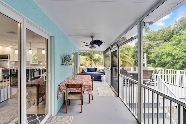 sunroom featuring sink and ceiling fan