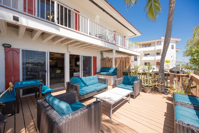 wooden terrace with an outdoor hangout area