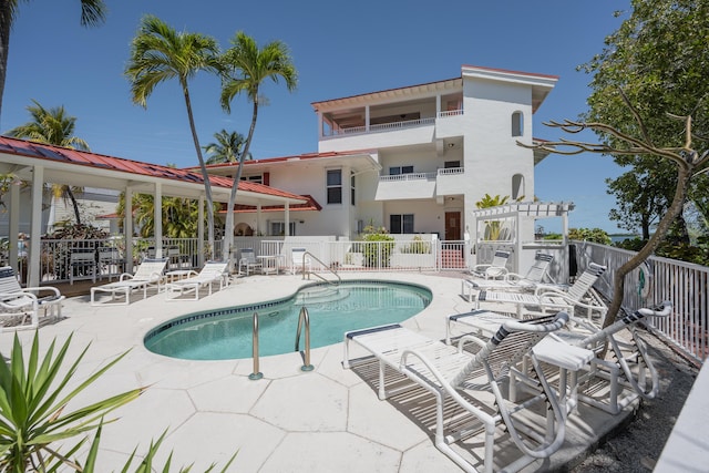 view of swimming pool featuring a pergola and a patio area