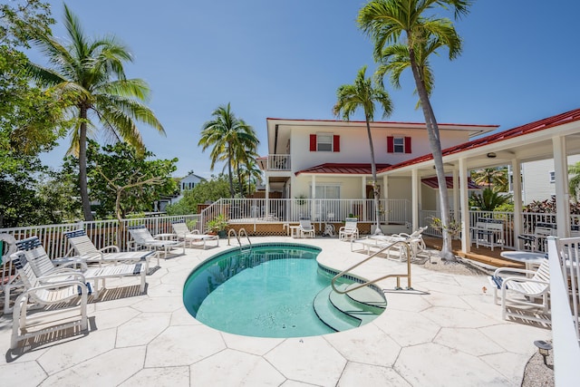 view of pool featuring a patio