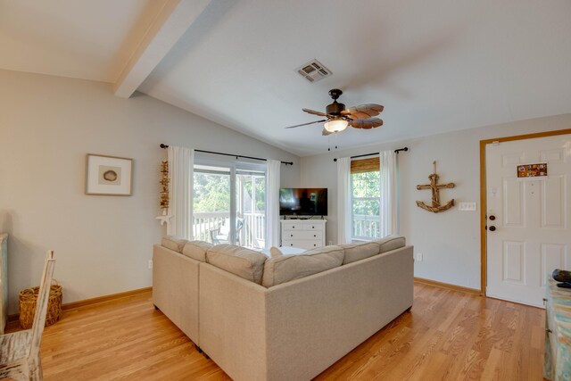 living room with vaulted ceiling with beams, light hardwood / wood-style floors, and ceiling fan