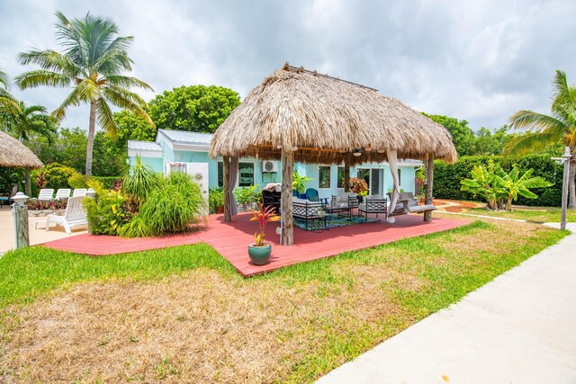 exterior space featuring an outdoor hangout area and a deck