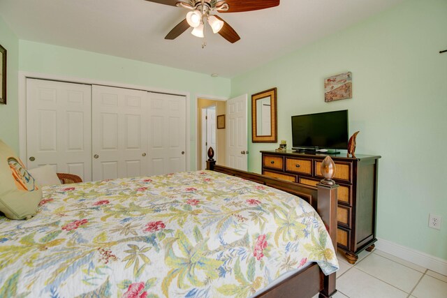 tiled bedroom with a closet and ceiling fan