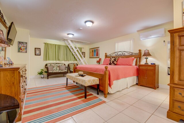 bedroom with light tile patterned flooring and a wall unit AC