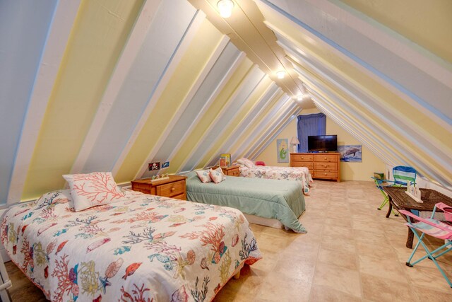 bedroom featuring vaulted ceiling