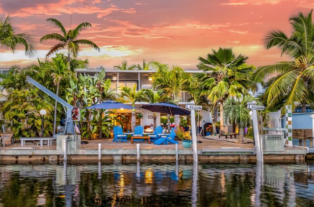 exterior space with a water view and a patio area