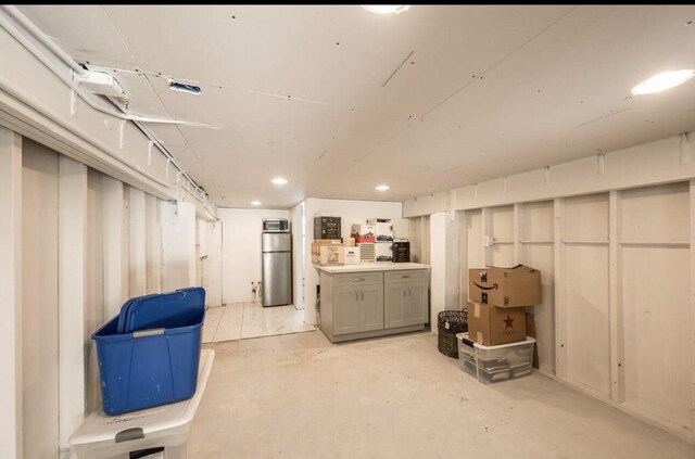 basement featuring refrigerator