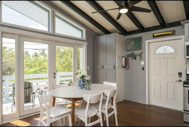 dining space with lofted ceiling with beams, french doors, and dark wood-type flooring