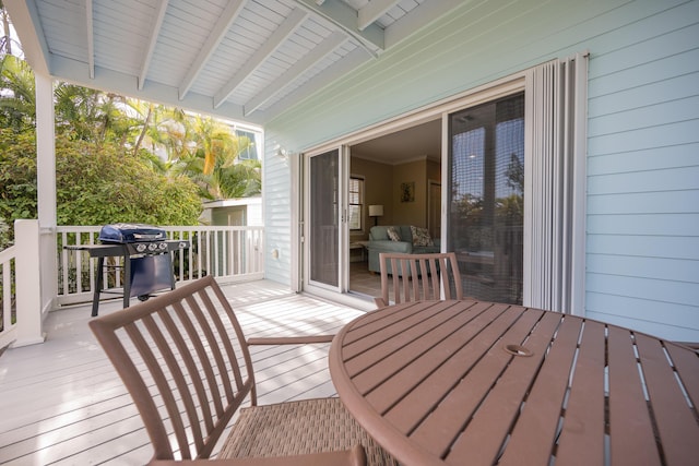 wooden terrace featuring area for grilling