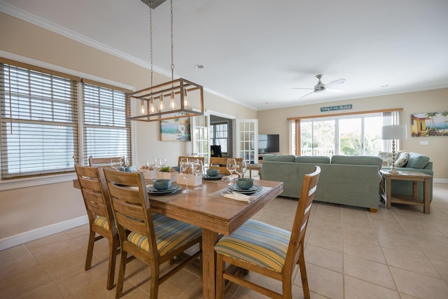 tiled dining area with crown molding and ceiling fan