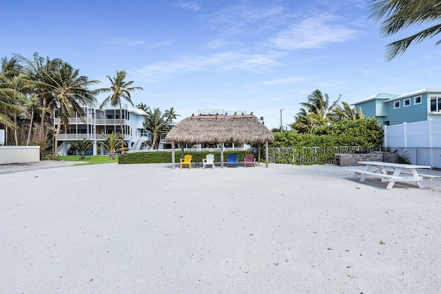 surrounding community featuring a gazebo and fence