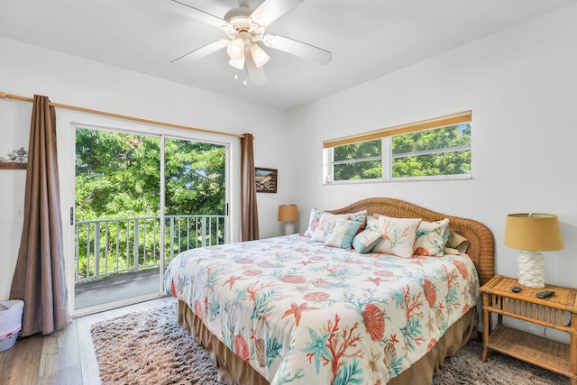 bedroom with access to exterior, hardwood / wood-style flooring, and ceiling fan