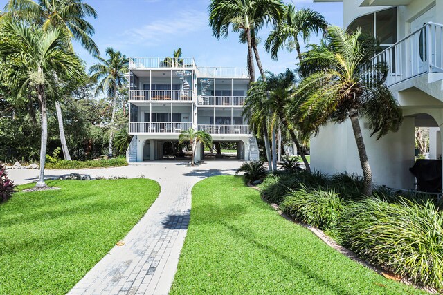 exterior space featuring stairs and decorative driveway