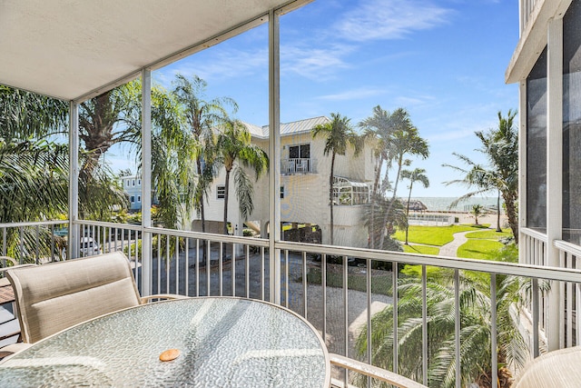 balcony featuring a water view