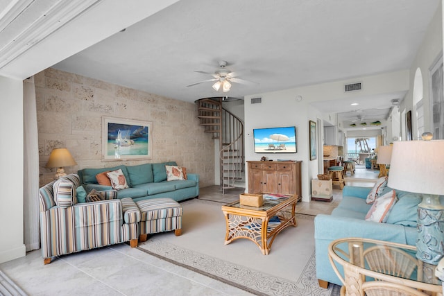 living room with light tile patterned floors and ceiling fan