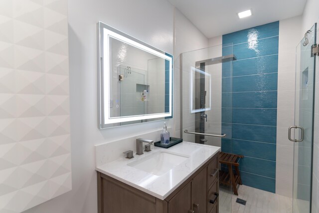 bathroom featuring vanity and walk in shower