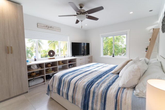 bedroom featuring ceiling fan and light tile patterned flooring